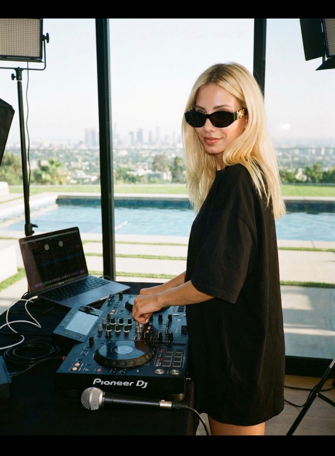 ELI F faith-based music artist DJ at Pioneer decks